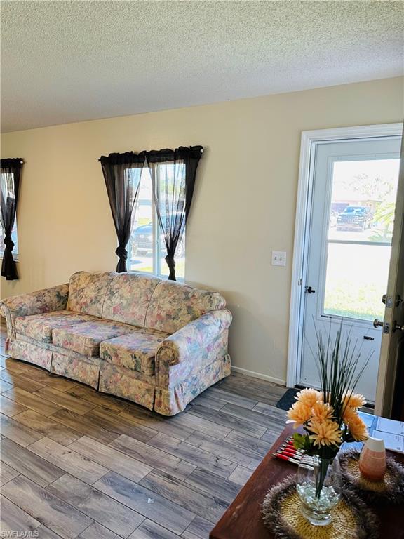 19040 Tampa Road South Fort Myers, FL 33967 - Photo 10 of 23 a bedroom with a bed and a dresser