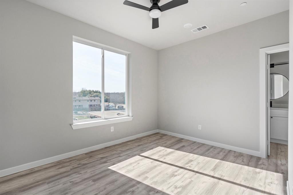 948 South Corinth St Road, Unit 6 Dallas, TX 75215 - Photo 20 of 27 a view of an empty room and a window