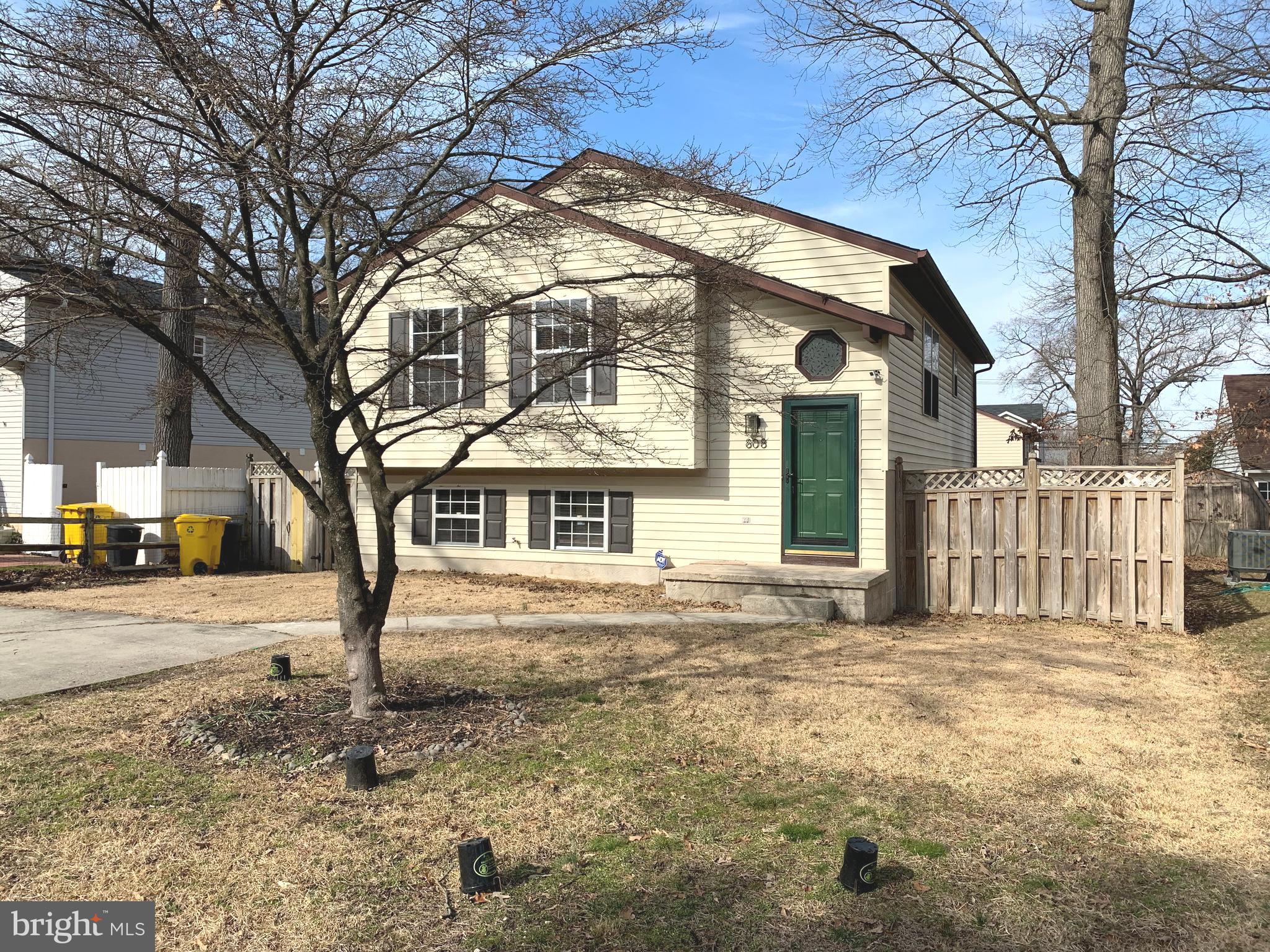 808 207th Street Pasadena, MD 21122 - Photo 1 of 20 a front view of a house with a yard