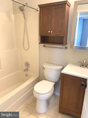 a bathroom with a toilet a sink and bathtub