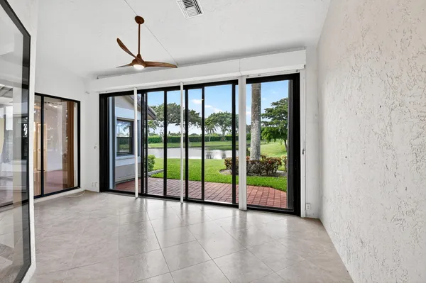 a kitchen with stainless steel appliances granite countertop a refrigerator a stove and a sink