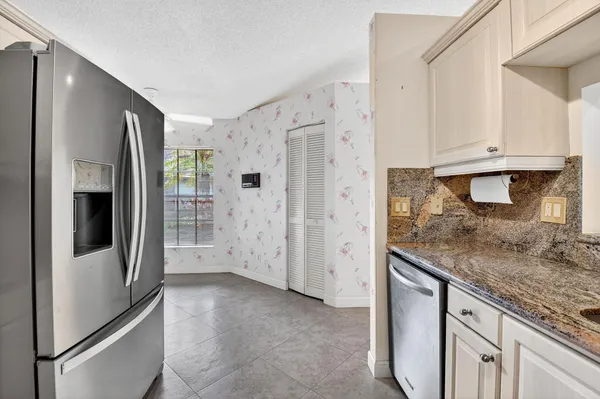 a spacious bathroom with a double vanity sink a and a mirror