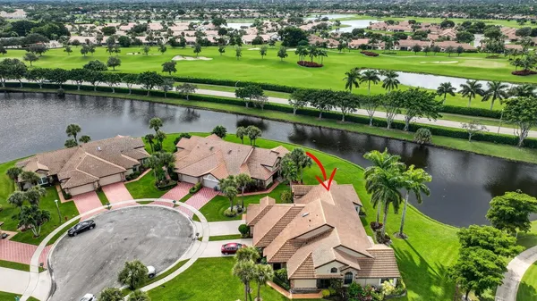 an aerial view of house with yard swimming pool and outdoor seating