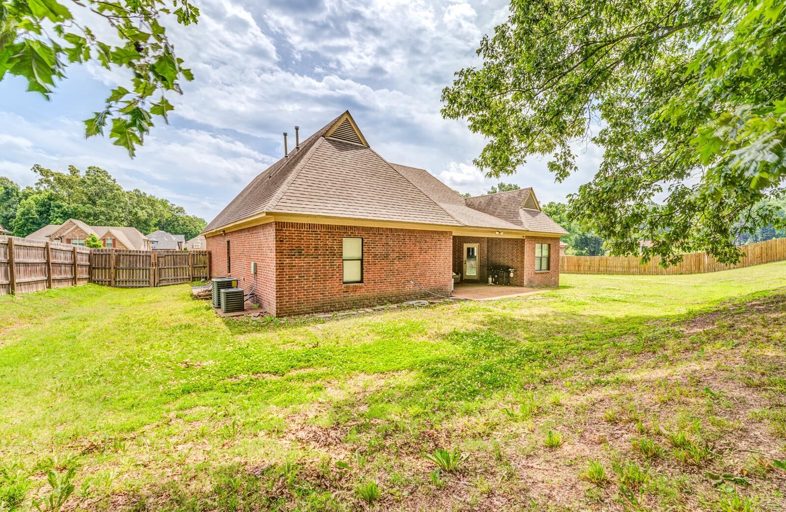 4671 Hampton Ridge Lane Bartlett, TN 38002 - Photo 39 of 40 Brick exterior with a gabled roofline and architectural window detail