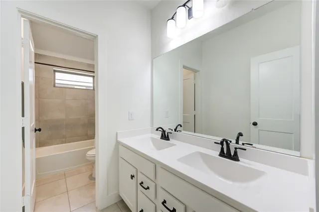 a bathroom with a sink a shower and a mirror