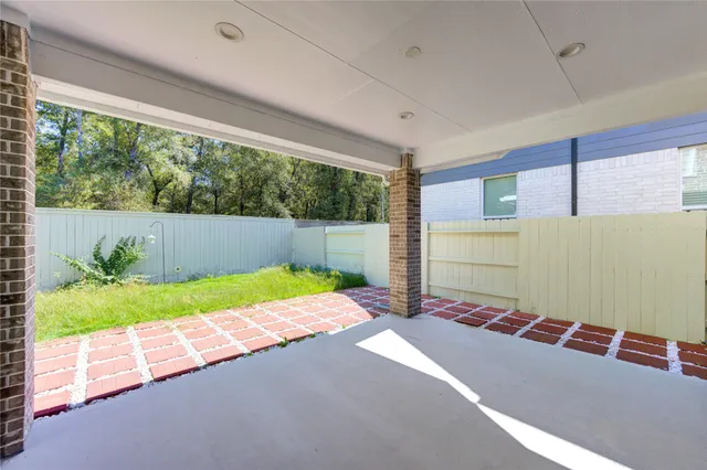 a house view with a backyard space