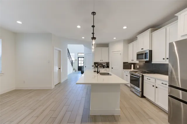 a large kitchen with cabinets