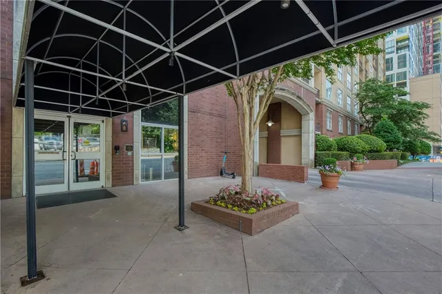 a living room with furniture fireplace and wooden floor