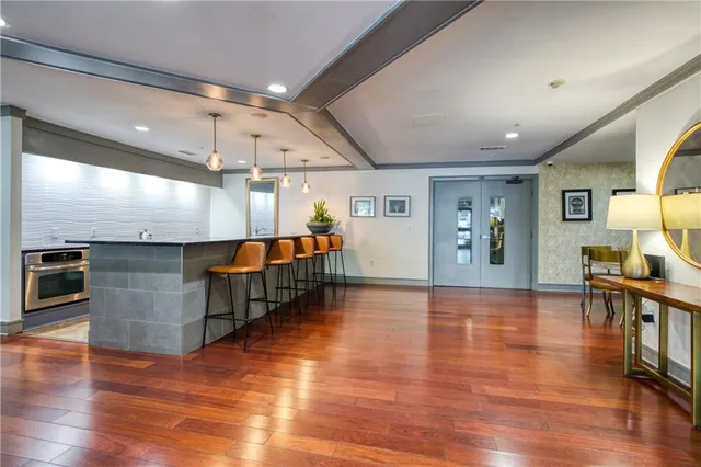 a living room with furniture window and wooden floor
