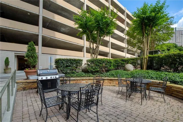 a view of a swimming pool with a patio