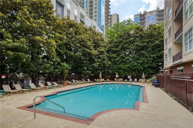a view of a swimming pool with a lounge chairs