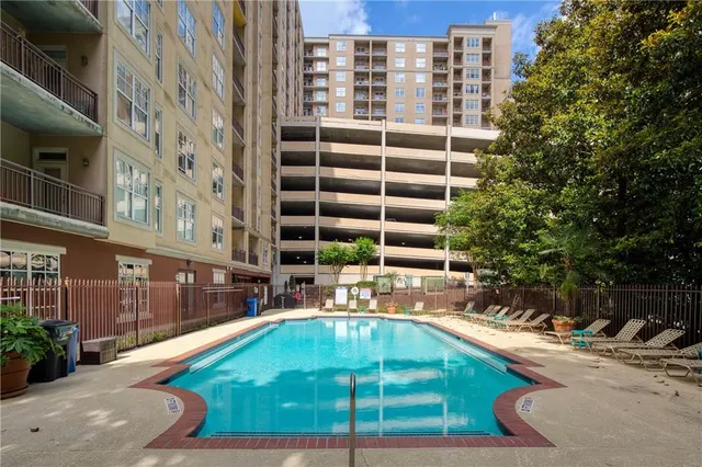 a view of a living room and kitchen with a large window