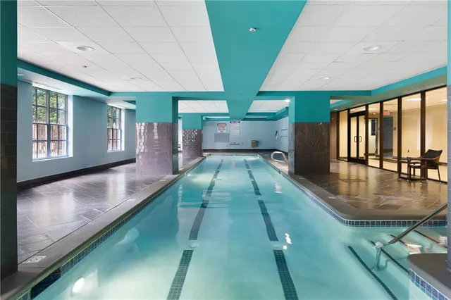a building outdoor space with patio furniture and potted plants
