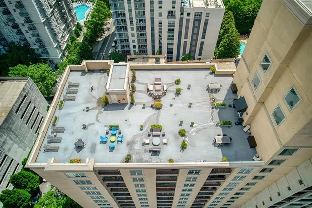 a view of a building with garden and plants