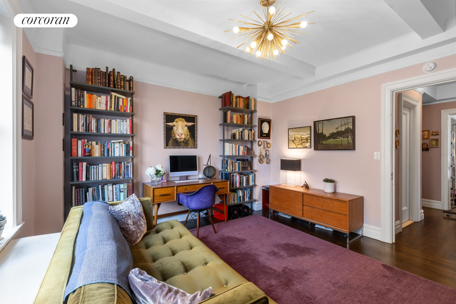 340 Riverside Drive, Unit 8C Manhattan, NY 10025 - Photo 10 of 12 a living room with furniture and a book shelf