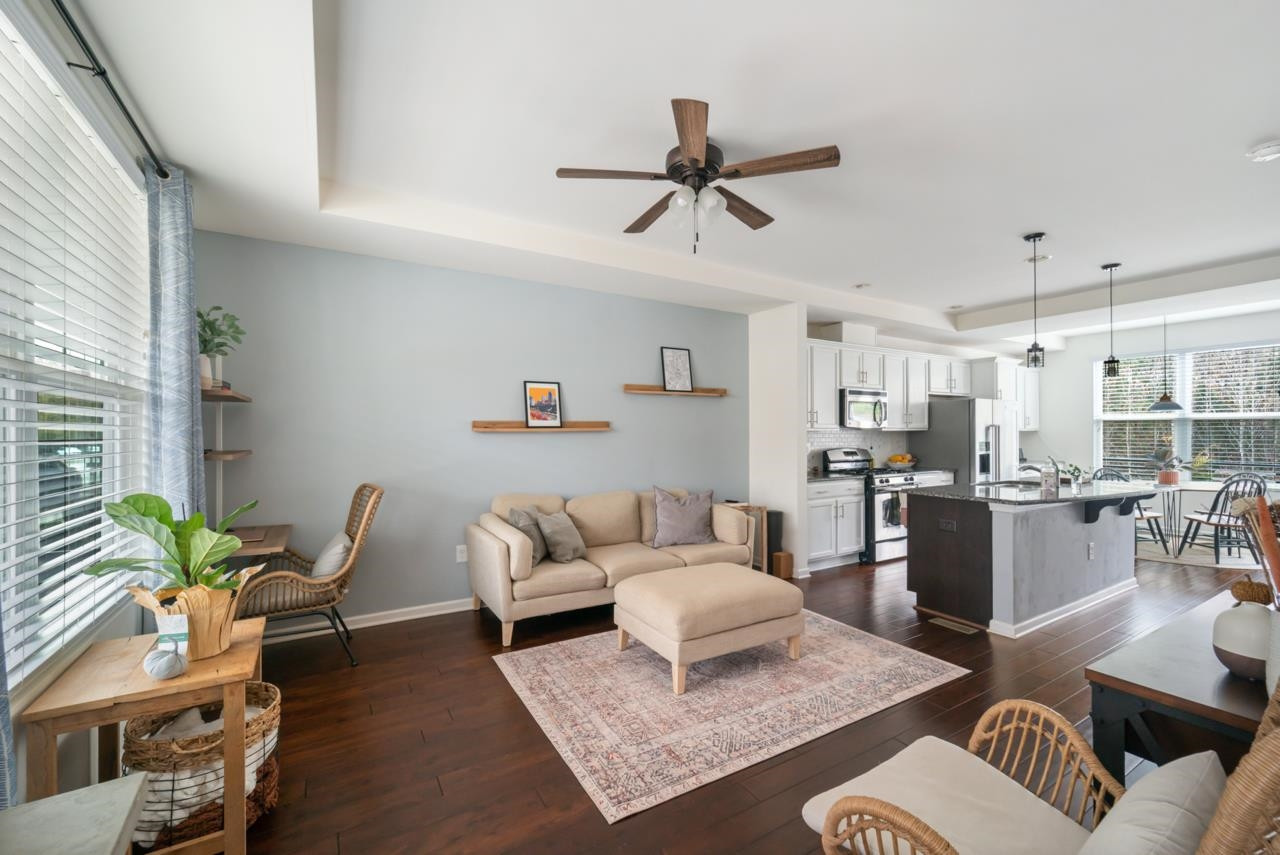 1617 Crafton Way Raleigh, NC 27607 - Photo 5 of 31 a living room with furniture kitchen view and a window
