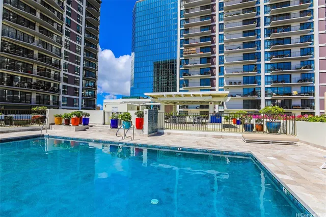 a view of a swimming pool with an outdoor seating