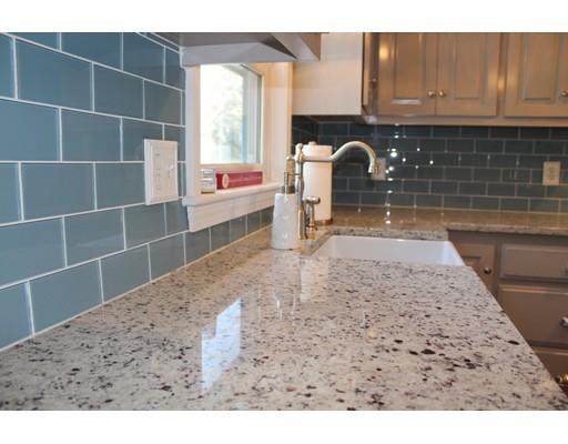 1 Wenzell Road Ashland, MA 01721 - Photo 9 of 20 a kitchen with a wooden floor and a sink