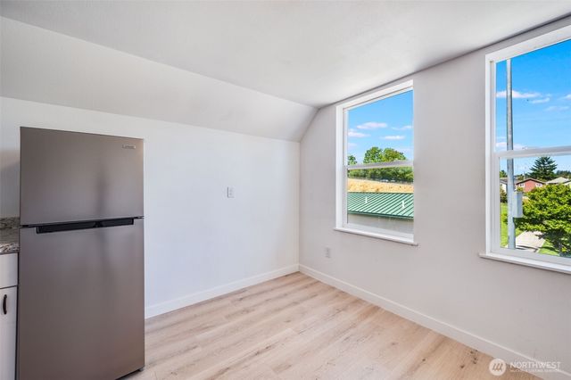 a view of a kitchen with a fridge