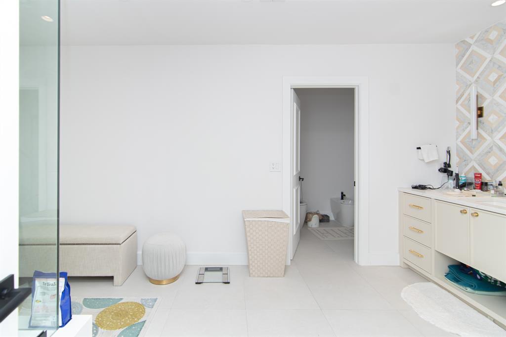 8208 Twin Lake Drive Boca Raton, FL 33496 - Photo 12 of 53 a bathroom with a sink toilet and vanity