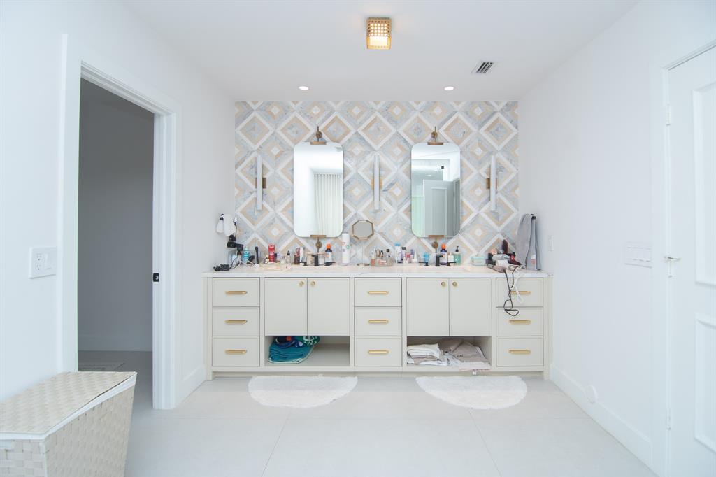 8208 Twin Lake Drive Boca Raton, FL 33496 - Photo 13 of 53 a bathroom with a sink and a mirror