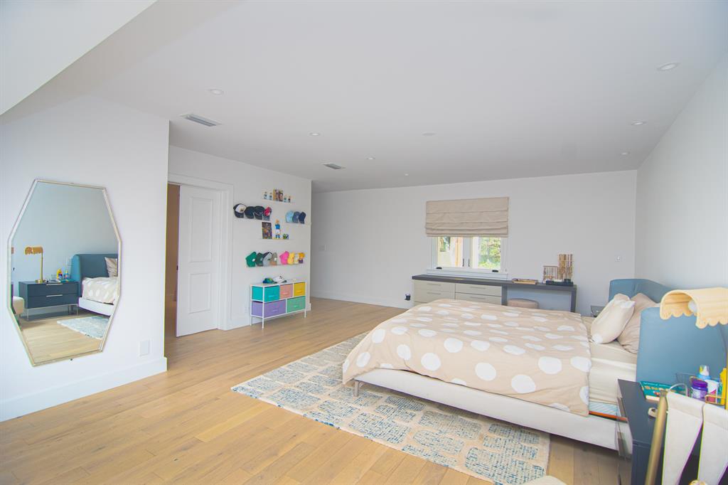 8208 Twin Lake Drive Boca Raton, FL 33496 - Photo 16 of 53 a bedroom with a bed and cabinets