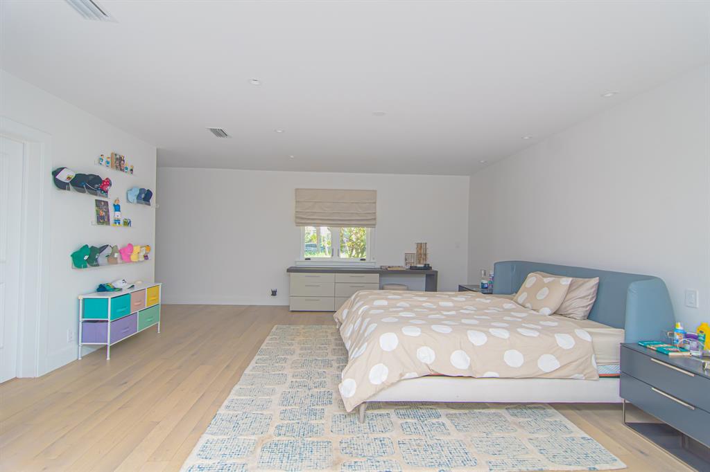 8208 Twin Lake Drive Boca Raton, FL 33496 - Photo 17 of 53 a bedroom with a bed and window