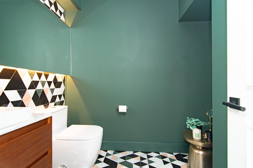 8208 Twin Lake Drive Boca Raton, FL 33496 - Photo 18 of 53 a white toilet sitting next to a shower curtain