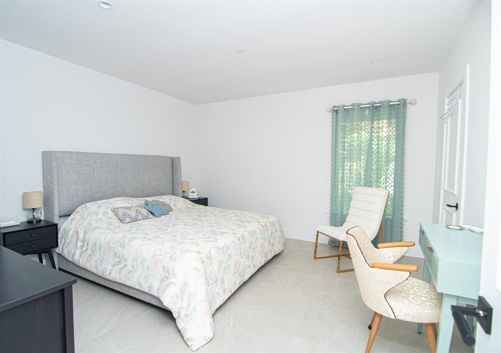 8208 Twin Lake Drive Boca Raton, FL 33496 - Photo 25 of 53 a bedroom with a bed chair and window