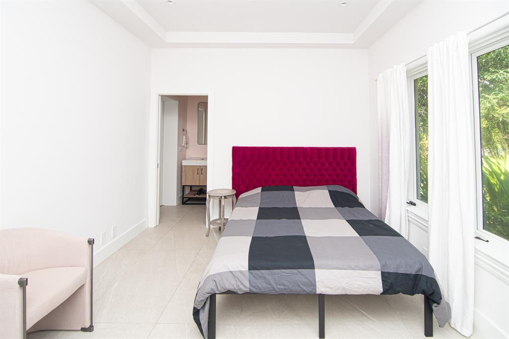 8208 Twin Lake Drive Boca Raton, FL 33496 - Photo 26 of 53 a living room with a couch and a potted plant with wooden floor