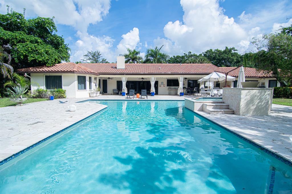 8208 Twin Lake Drive Boca Raton, FL 33496 - Photo 28 of 53 front view of a house with a yard