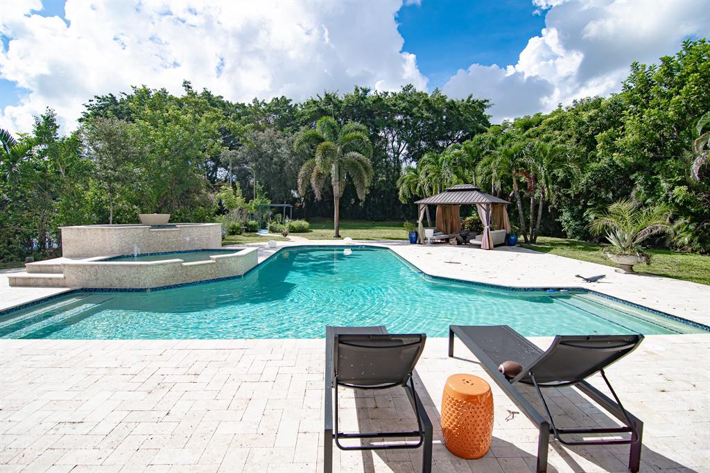 8208 Twin Lake Drive Boca Raton, FL 33496 - Photo 29 of 53 a view of an chairs and table in patio