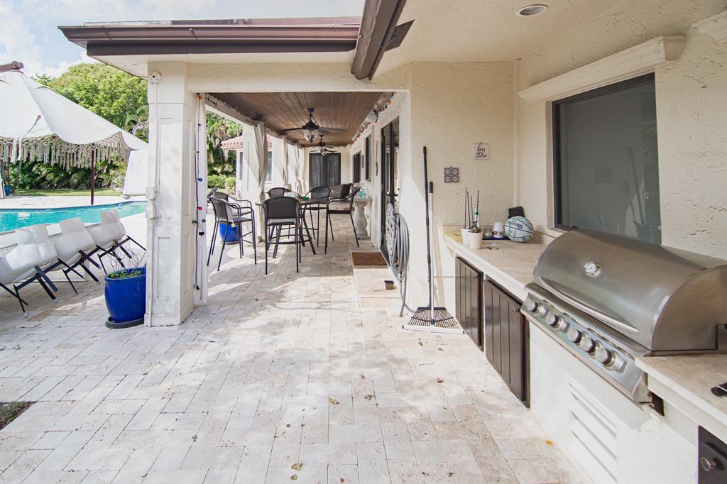 8208 Twin Lake Drive Boca Raton, FL 33496 - Photo 41 of 53 a view of a chairs and table in a patio