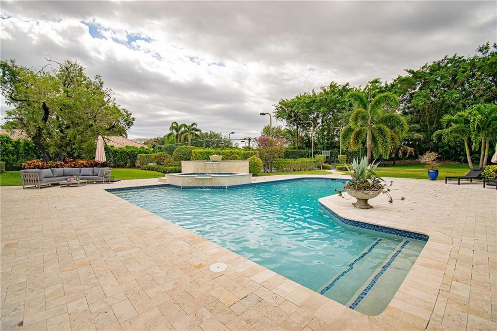 8208 Twin Lake Drive Boca Raton, FL 33496 - Photo 52 of 53 a view of a swimming pool with a patio