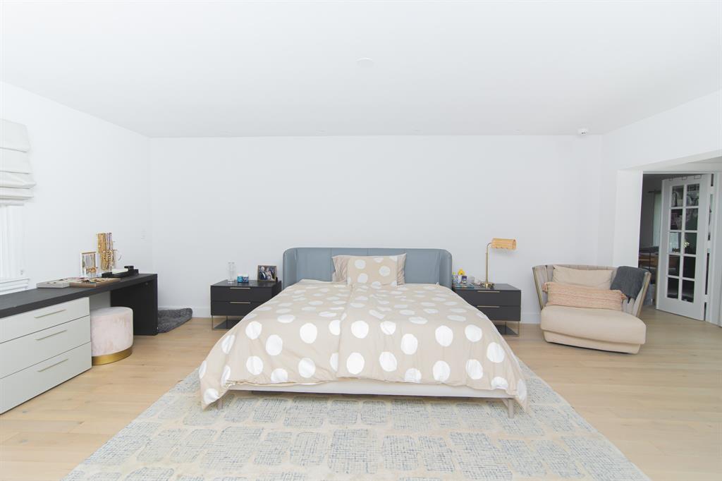 8208 Twin Lake Drive Boca Raton, FL 33496 - Photo 8 of 53 a large white bed sitting in a living room