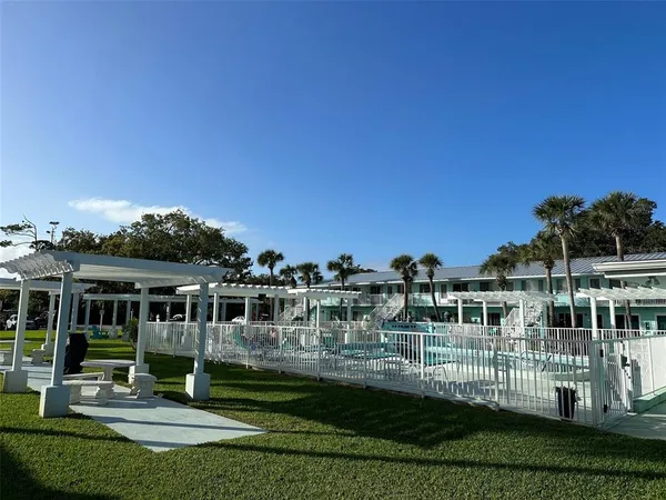 a living room with lots of chairs and a projector
