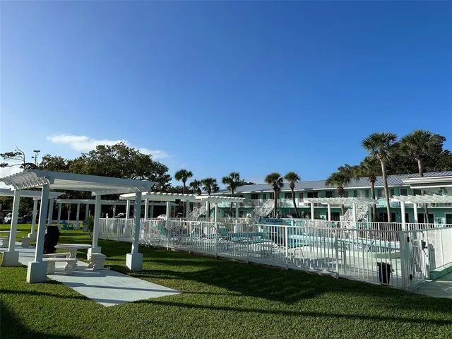 a living room with lots of chairs and a projector