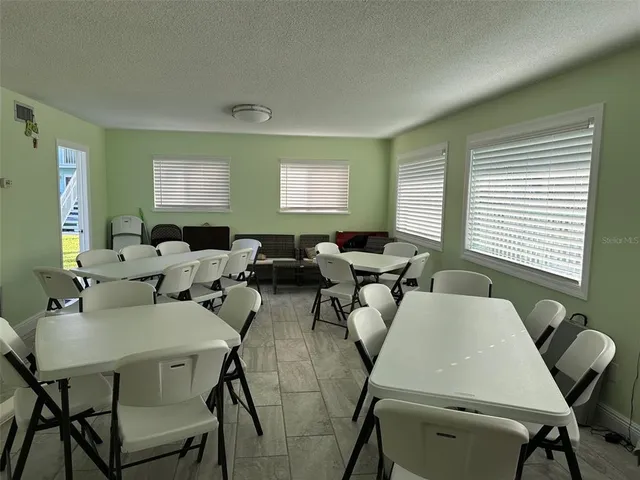 a black white refrigerator freezer sitting inside of a kitchen