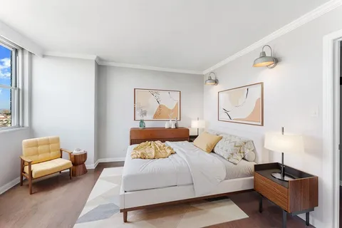 a bed room with a bed and a couch