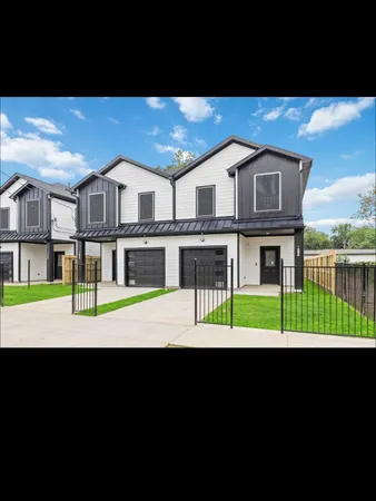 a front view of a house with a big yard