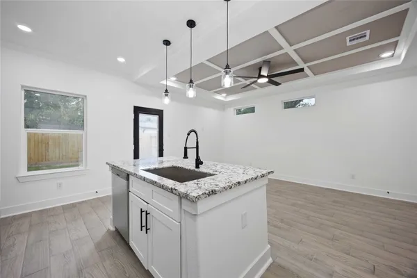 a view of a bathroom with a sink and a mirror