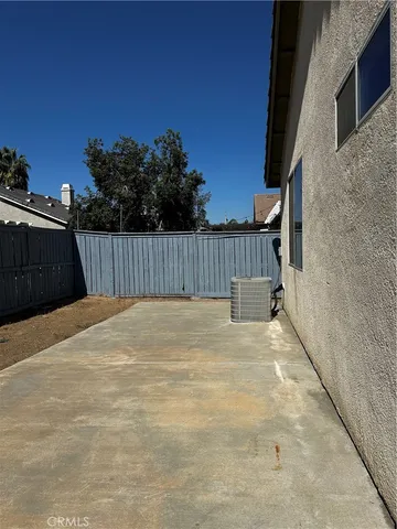 a view of a backyard of the house