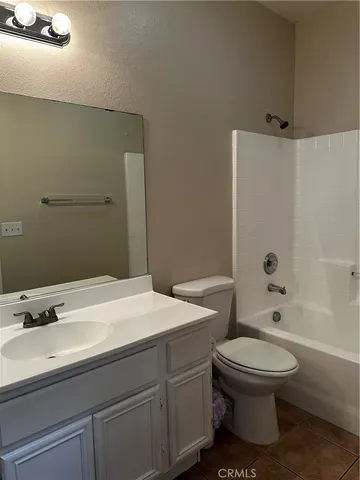 a bathroom with a sink a toilet and a bathtub