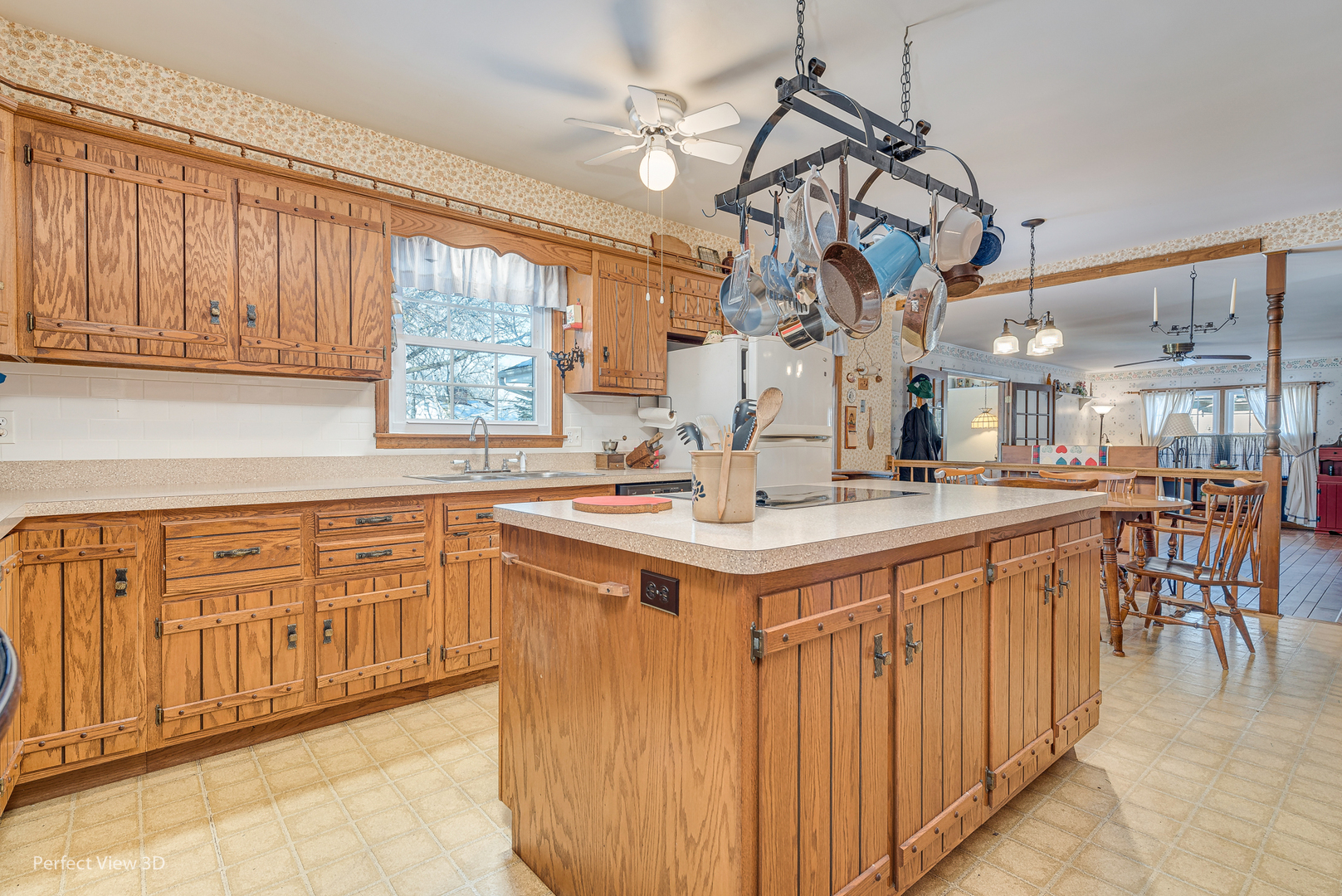 313 Alschuler Drive Aurora, IL 60506 - Photo 13 of 23 a kitchen with stainless steel appliances granite countertop a sink a stove cabinets dining table and chairs