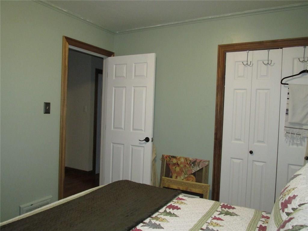 392 Maple Summit Road Mill Run, PA 15464 - Photo 13 of 25 Closet on the right has double bi-fold doors. Six panel doors are found through out the home.