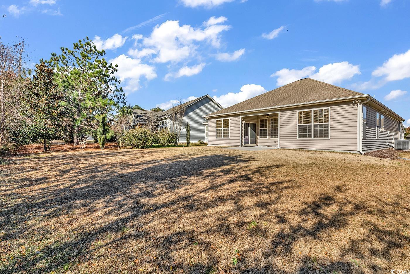 1612 Fairforest Court Conway, SC 29526 - Photo 39 of 40 Back of property with a patio and a yard