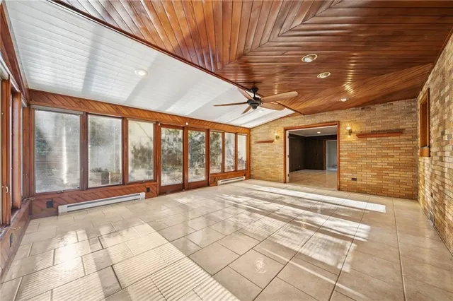 a view of an empty room with a fireplace