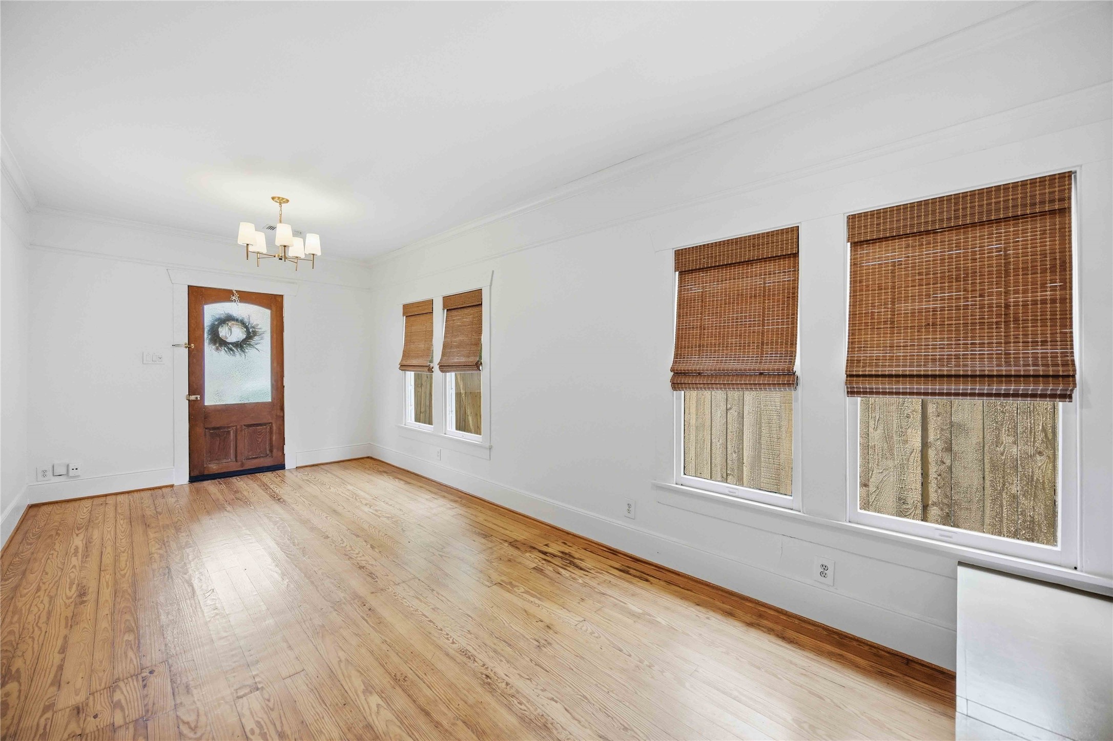 208 Archer Street Houston, TX 77009 - Photo 8 of 26 Vintage wood floors and high ceilings throughout the home. Naturally lit rooms with tasteful window treatments.