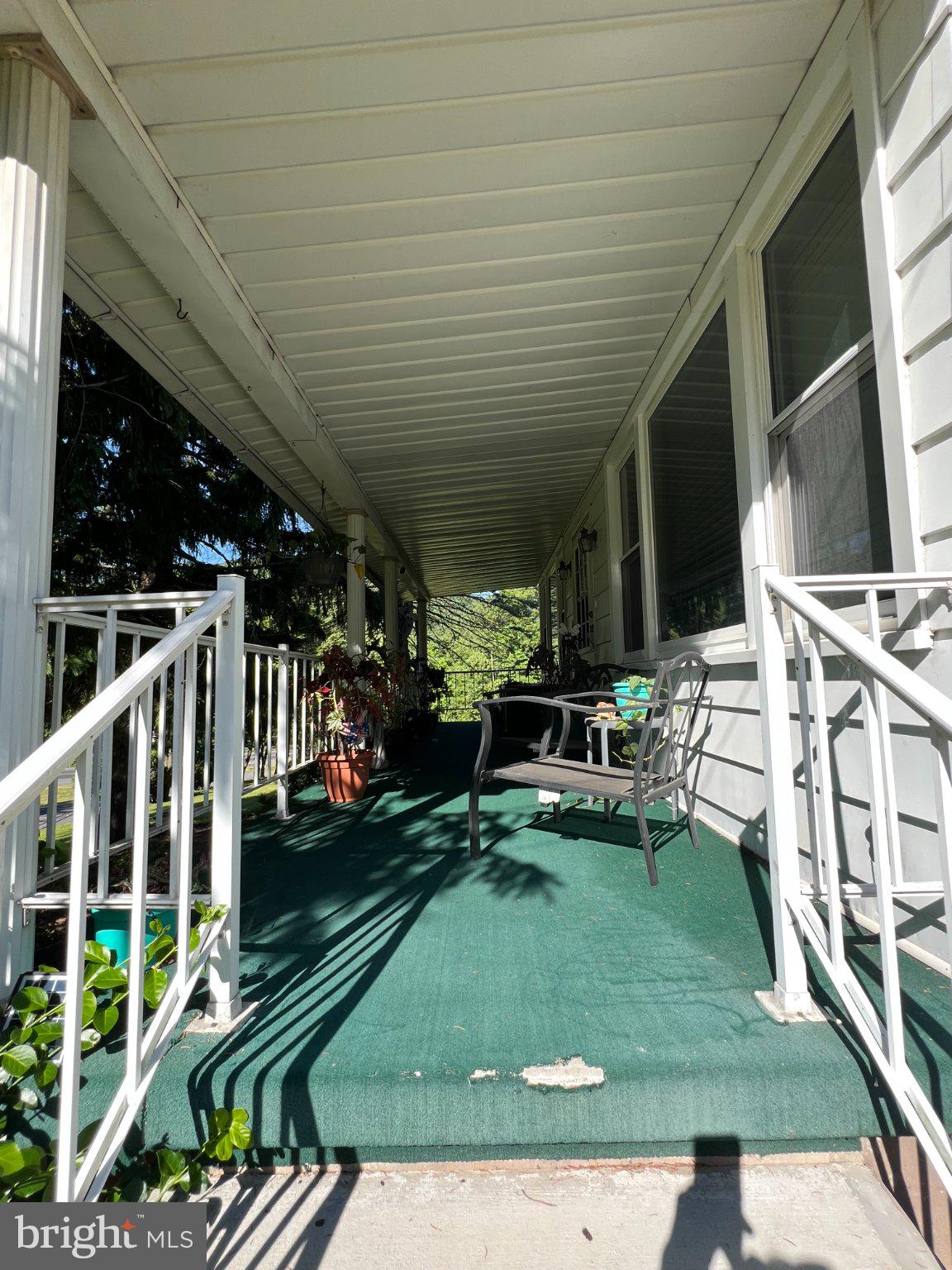 11402 Red Hill Road Southwest La Vale, MD 21502 - Photo 58 of 92 Inviting porch with lush greenery.