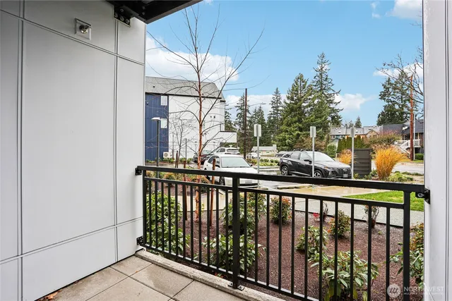 a view of a balcony with a potted plant